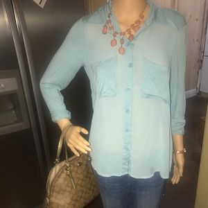 Never worn ISSI light blue top